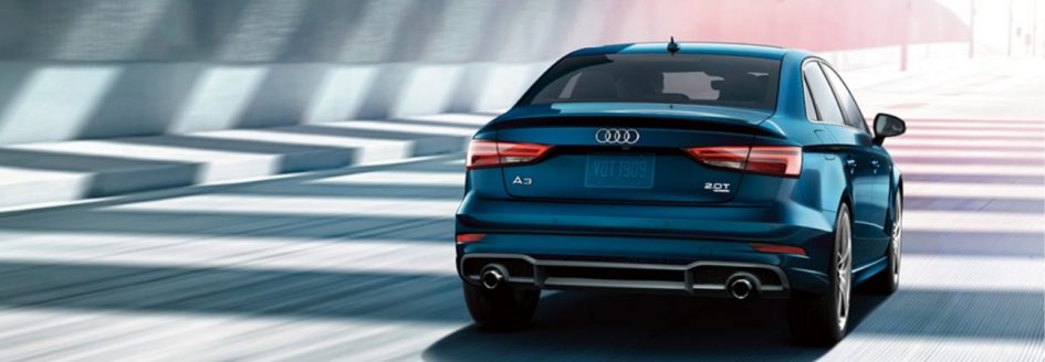 2019 Audi A3 in blue driving down a city street